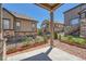 Outdoor patio showcases a view of neighboring homes and landscaped yard, ideal for relaxing at 7693 S Quantock Way, Aurora, CO 80016