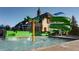 Community pool area featuring water slides and interactive water features for Gathering fun at 7693 S Quantock Way, Aurora, CO 80016