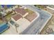 Aerial shot showcases the property with its solar panels, long driveway, and landscaped surroundings at 6545 Union St, Arvada, CO 80004