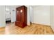 Spacious basement area with wood-look floors featuring a closet or cabinet at 6545 Union St, Arvada, CO 80004