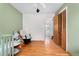 Spacious bedroom features hardwood floors, closet, and a glimpse into an en-suite bathroom at 6545 Union St, Arvada, CO 80004