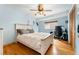 Cozy bedroom features a queen size bed, hardwood floors, and a small workspace at 6545 Union St, Arvada, CO 80004