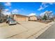 Spacious two-car garage and long driveway offer ample parking, complemented by the home's charming curb appeal at 6545 Union St, Arvada, CO 80004