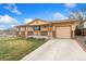 Inviting ranch style home with a spacious driveway and attached garage at 6545 Union St, Arvada, CO 80004
