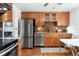 This well-lit kitchen features stainless steel appliances, stylish backsplash, and ample cabinet space at 6545 Union St, Arvada, CO 80004