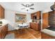 Well-lit kitchen showcasing stainless appliances, wood cabinets, and eat-in breakfast nook at 6545 Union St, Arvada, CO 80004