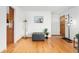 Bright living room showcasing hardwood floors, stylish decor, and a welcoming entrance at 6545 Union St, Arvada, CO 80004