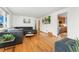 Bright living room with hardwood floors, modern decor, and large windows offers a comfortable and stylish space at 6545 Union St, Arvada, CO 80004