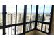 View from a balcony overlooking neighborhood buildings and treed landscape at 13890 E Marina Dr # 602, Aurora, CO 80014