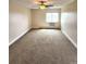 A carpeted bedroom with a ceiling fan and a window air conditioner at 13890 E Marina Dr # 602, Aurora, CO 80014