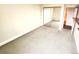Spacious carpeted bedroom featuring mirror sliding closet doors at 13890 E Marina Dr # 602, Aurora, CO 80014