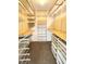 Walk-in closet with custom shelves and storage solutions for optimal organization at 13890 E Marina Dr # 602, Aurora, CO 80014