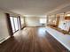 Spacious living room featuring wood floors, natural light, and an open layout, perfect for entertaining and relaxing at 13890 E Marina Dr # 602, Aurora, CO 80014