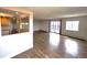 Bright living space boasts wood flooring, access to a balcony, and an open flow to the modern kitchen with granite countertops at 13890 E Marina Dr # 602, Aurora, CO 80014