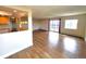 Inviting living room with hardwood floors, sliding glass doors, and an open connection to a modern, well-equipped kitchen at 13890 E Marina Dr # 602, Aurora, CO 80014