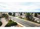 Elevated view from the home showcasing the surrounding neighborhood, green spaces, and an expanse of the natural landscape at 13890 E Marina Dr # 602, Aurora, CO 80014