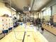 Large workshop featuring workbenches, tools, and ample space for various projects and hobbies at 13890 E Marina Dr # 602, Aurora, CO 80014