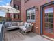 A cozy deck offers outdoor seating, perfect for relaxation and enjoying the property's appeal at 8450 E 29Th Ave, Denver, CO 80238