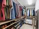 Organized walk-in closet with shelving, hanging racks, and ample storage space at 8450 E 29Th Ave, Denver, CO 80238