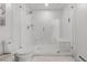 Bright bathroom features a toilet, and glass enclosed marble shower with bench at 2518 N State Highway 67, Sedalia, CO 80135