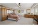 Bedroom featuring an attached wardrobe, and a matching dresser and mirror at 2518 N State Highway 67, Sedalia, CO 80135