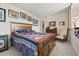 Spacious bedroom with wooden furniture, a vibrant quilt, and classic decor at 2518 N State Highway 67, Sedalia, CO 80135