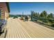 Expansive deck with a grill and picnic table perfect for outdoor dining and enjoying the picturesque scenery at 2518 N State Highway 67, Sedalia, CO 80135