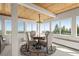 Bright dining room with beautiful views, wood ceiling, and updated lighting fixture at 2518 N State Highway 67, Sedalia, CO 80135
