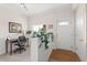 Bright entryway with a cozy desk, plants, and classic wainscoting at 2518 N State Highway 67, Sedalia, CO 80135