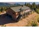 Beautiful log home with a stone foundation, two-car garage, and scenic mountain views at 2518 N State Highway 67, Sedalia, CO 80135