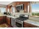 Updated kitchen featuring stainless steel appliances, granite countertops, and scenic view at 2518 N State Highway 67, Sedalia, CO 80135