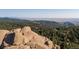Stunning boulder landscape with a forest backdrop and panoramic views of the surrounding terrain at 2518 N State Highway 67, Sedalia, CO 80135