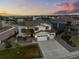 An aerial view of a home in a well-maintained neighborhood, showcasing its premium lot and landscaping at 6696 Kenzie Cir, Castle Pines, CO 80108