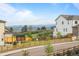 Expansive backyard featuring a trampoline, wooden fence, beautiful scenery, and mountain views at 6696 Kenzie Cir, Castle Pines, CO 80108