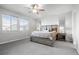 Cozy bedroom with plush carpeting, neutral tones, and dual bedside tables with lamps at 6696 Kenzie Cir, Castle Pines, CO 80108
