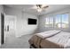 Comfortable bedroom with carpet and mounted TV at 6696 Kenzie Cir, Castle Pines, CO 80108