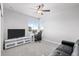 Bright bedroom with large windows, ceiling fan, and flexible space for a home office or study at 6696 Kenzie Cir, Castle Pines, CO 80108