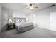 Serene bedroom with a king-sized bed, carpeting, and a ceiling fan at 6696 Kenzie Cir, Castle Pines, CO 80108