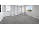 Versatile bonus room featuring a built-in bookcase for storage and display with neutral carpet at 6696 Kenzie Cir, Castle Pines, CO 80108