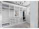 A spacious walk-in closet with custom shelving, drawers, and ample hanging space at 6696 Kenzie Cir, Castle Pines, CO 80108