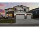 Beautiful two-story home boasting a three-car garage, manicured lawn, and classic architectural details at 6696 Kenzie Cir, Castle Pines, CO 80108