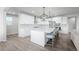 Bright kitchen with stainless steel appliances, a large island, and pendant lighting at 6696 Kenzie Cir, Castle Pines, CO 80108