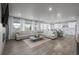 Spacious living room featuring an open floor plan, hardwood floors, and a cozy fireplace at 6696 Kenzie Cir, Castle Pines, CO 80108
