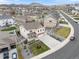 Expansive aerial view of a Gathering home in a quiet neighborhood with rolling hills at 5842 High Timber Cir, Castle Rock, CO 80104