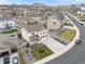 Aerial view of a well-maintained home with a spacious yard, detached garage, and long driveway in a suburban neighborhood at 5842 High Timber Cir, Castle Rock, CO 80104
