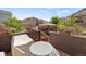 View of the backyard deck with flower pots and partially covered outdoor furniture at 5842 High Timber Cir, Castle Rock, CO 80104