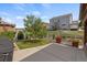 Spacious backyard patio with landscaped yard, wood bench, and barbecue grill at 5842 High Timber Cir, Castle Rock, CO 80104