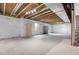 Unfinished basement offers ample space for storage or customization with exposed beams and wrapped walls at 5842 High Timber Cir, Castle Rock, CO 80104