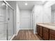 Bathroom with double vanity, dark wood cabinets, and a separate shower to provide a bright and modern feel at 5842 High Timber Cir, Castle Rock, CO 80104