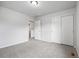 A very spacious bedroom with neutral paint, plush carpet and large closet with sliding doors at 5842 High Timber Cir, Castle Rock, CO 80104